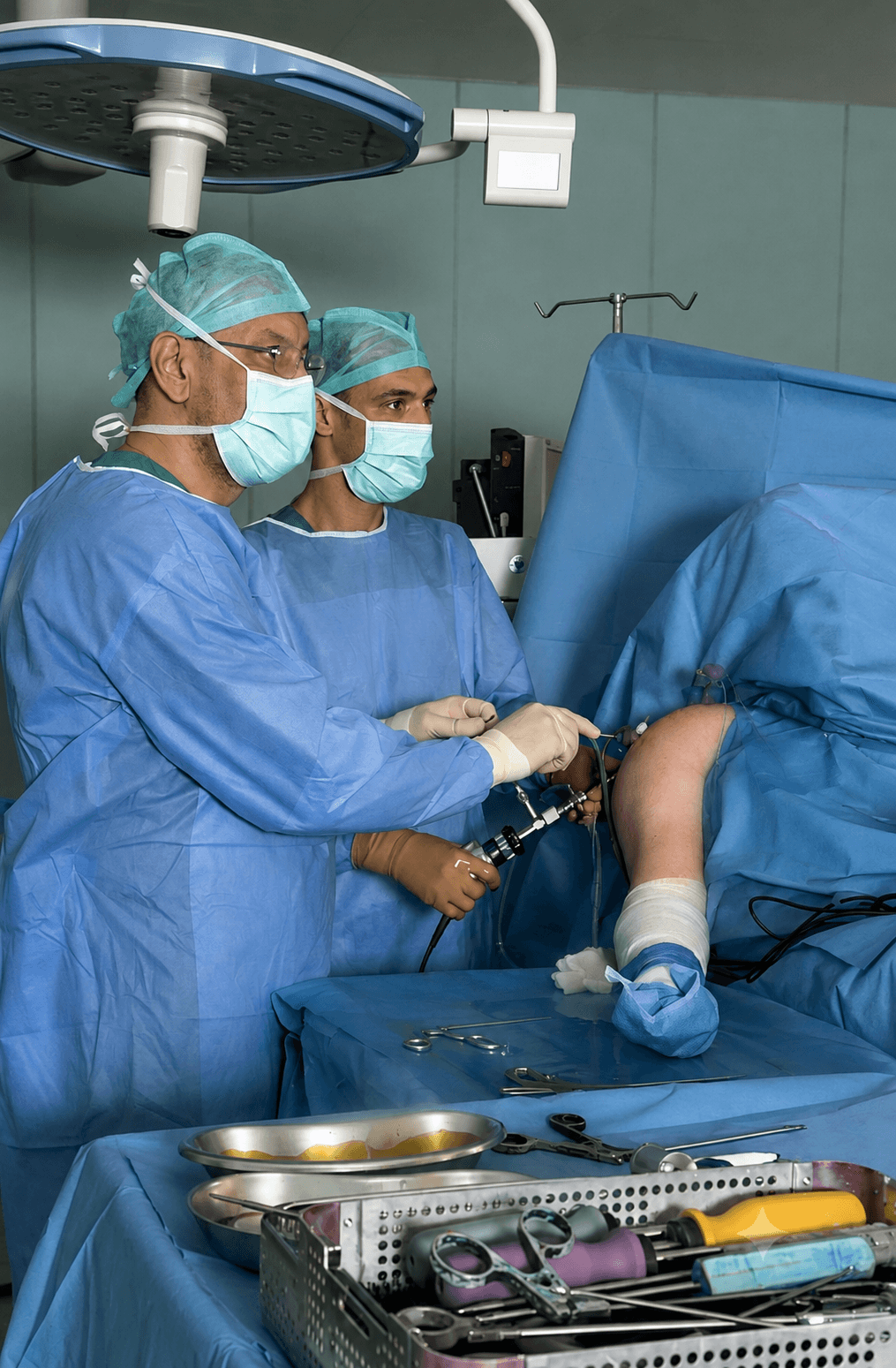 Surgical team performing ankle arthroscopy
